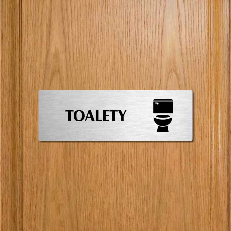 Toalety, stříbrná popiska na dveře